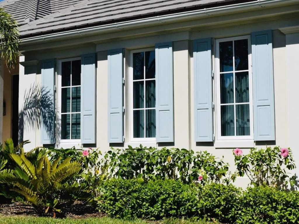 Exterior hurricane shutters on residential home