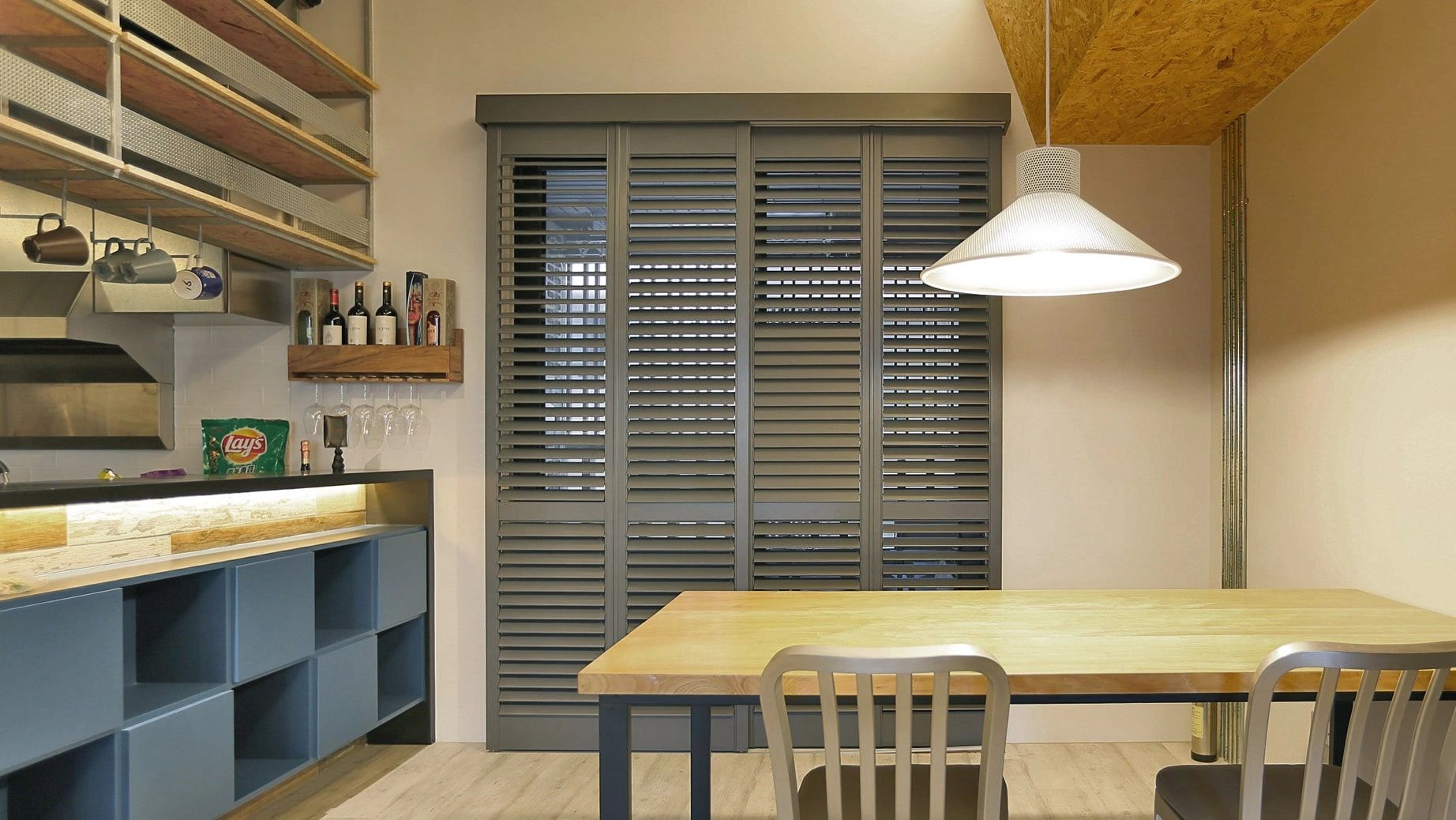 Modern interior shutters installed in living room